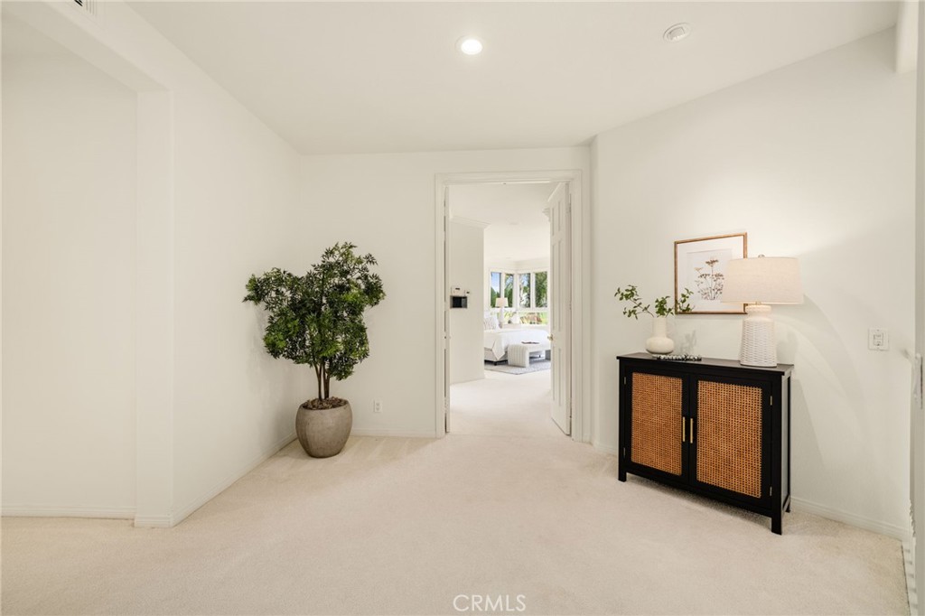 Upstairs landing outside of the entrance to the primary suite. - 6461 Morningside Drive, Huntington Beach CA 92648 - photo 25