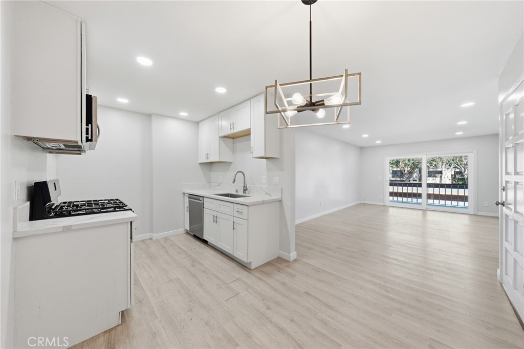 Photos have been digitally enhanced. - 6600 Warner 205, Huntington Beach CA 92647 - photo 1