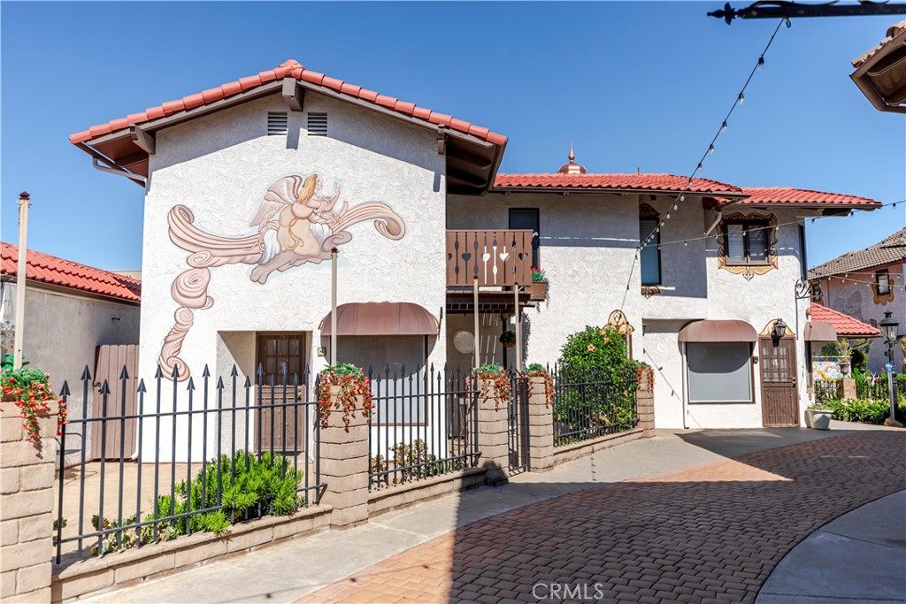 Rare freestanding live/work home in Old World Village! Huge structure! - 7561 Center 4, Huntington Beach CA 92647 - photo 1