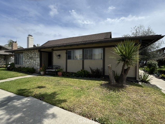front of fourplex - entrance on side - 7562 Volga Drive 2, Huntington Beach CA 92647 - photo 1