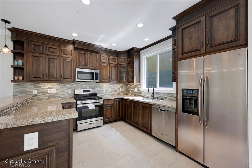 Spacious Kitchen. Virtually Staged with Stainless Steel Refrigerator - 7776 Liberty, Huntington Beach CA 92647 - photo 5