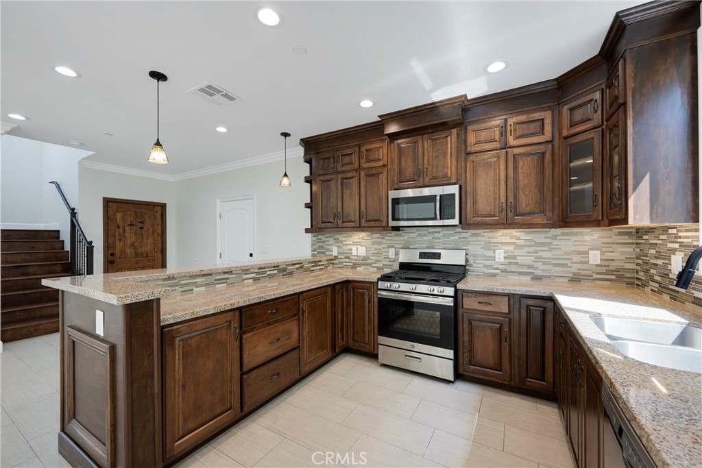 Chef's Kitchen with Granite Countertops and Beautiful Cabinetry! - 7776 Liberty, Huntington Beach CA 92647 - photo 6
