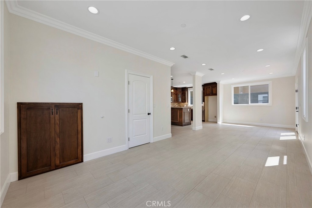 Open Floor Plan. Living Room, Dining Area & Kitchen - 7776 Liberty, Huntington Beach CA 92647 - photo 15