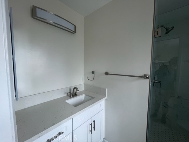 NEW BATHROOMS, NEW LIGHT FIXTURES, MIRRORS HAVE BEEN ADDED. - 7812 Shaffer Circle 3, Huntington Beach CA 92648 - photo 9