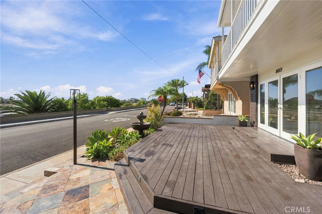 Another front-deck perspective showcases this unique single-loaded street and how few cars there are. - 803 Frankfort Avenue, Huntington Beach CA 92648 - photo 7