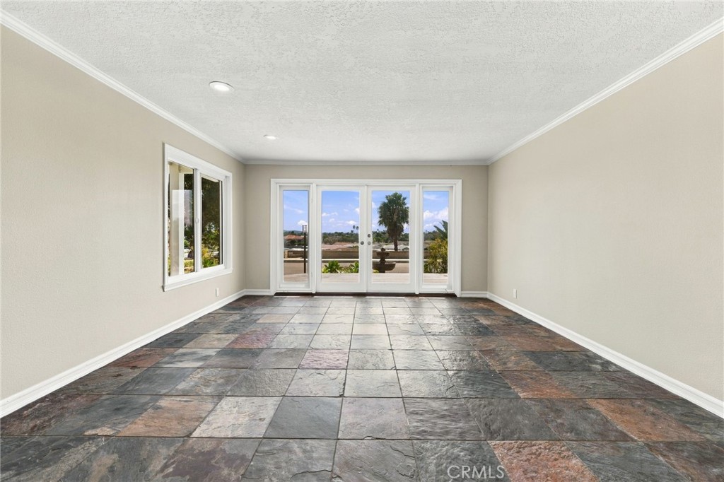 Large windows fill the living room with natural light while maintaining an easy connection to the front deck. - 803 Frankfort Avenue, Huntington Beach CA 92648 - photo 12