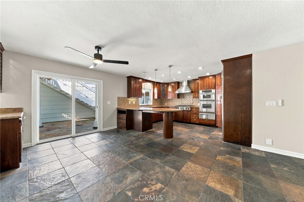 Open sightlines connect the dining area with the kitchen and surrounding main-level living spaces. - 803 Frankfort Avenue, Huntington Beach CA 92648 - photo 17