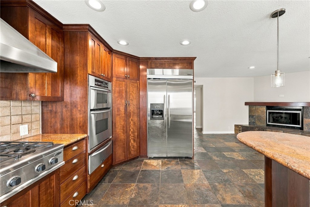 Extensive cabinetry and counter space provide excellent storage and functionality throughout the kitchen. - 803 Frankfort Avenue, Huntington Beach CA 92648 - photo 20