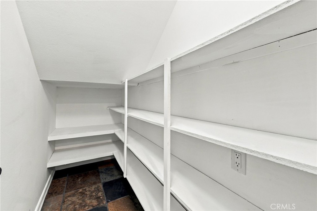 Walk-in pantry tucked beneath the staircase provides valuable additional storage. - 803 Frankfort Avenue, Huntington Beach CA 92648 - photo 26