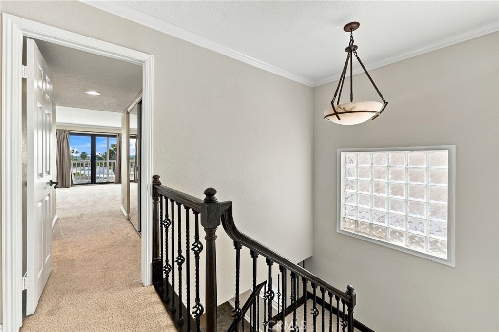 Upstairs landing connects the bedrooms, bathrooms, and multiple outdoor living areas. - 803 Frankfort Avenue, Huntington Beach CA 92648 - photo 30