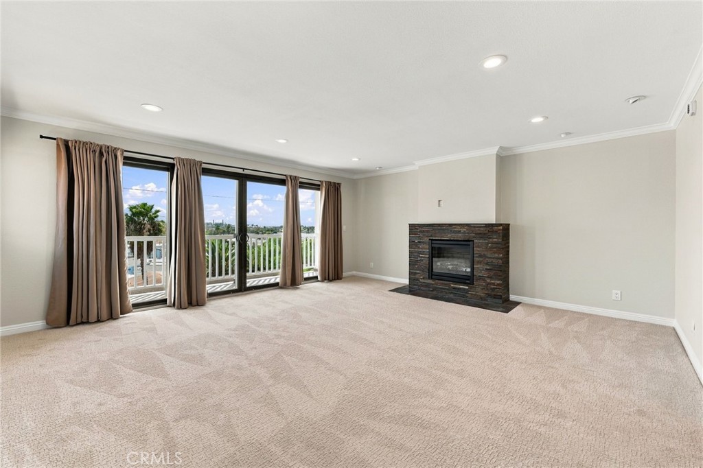 Multiple French sliders bring natural light into the primary suite and open directly to the expansive balcony. - 803 Frankfort Avenue, Huntington Beach CA 92648 - photo 33