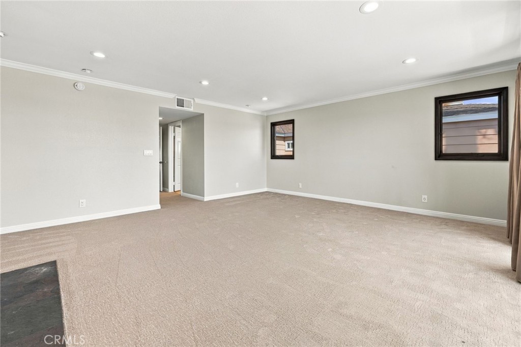 Generous primary suite provides ample room for multiple furniture arrangements. - 803 Frankfort Avenue, Huntington Beach CA 92648 - photo 35