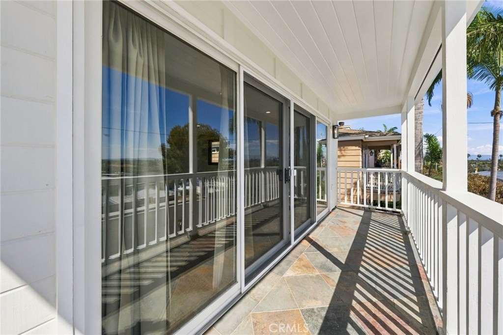 Expansive full-width balcony creates another exceptional outdoor living space directly off the primary suite. - 803 Frankfort Avenue, Huntington Beach CA 92648 - photo 40