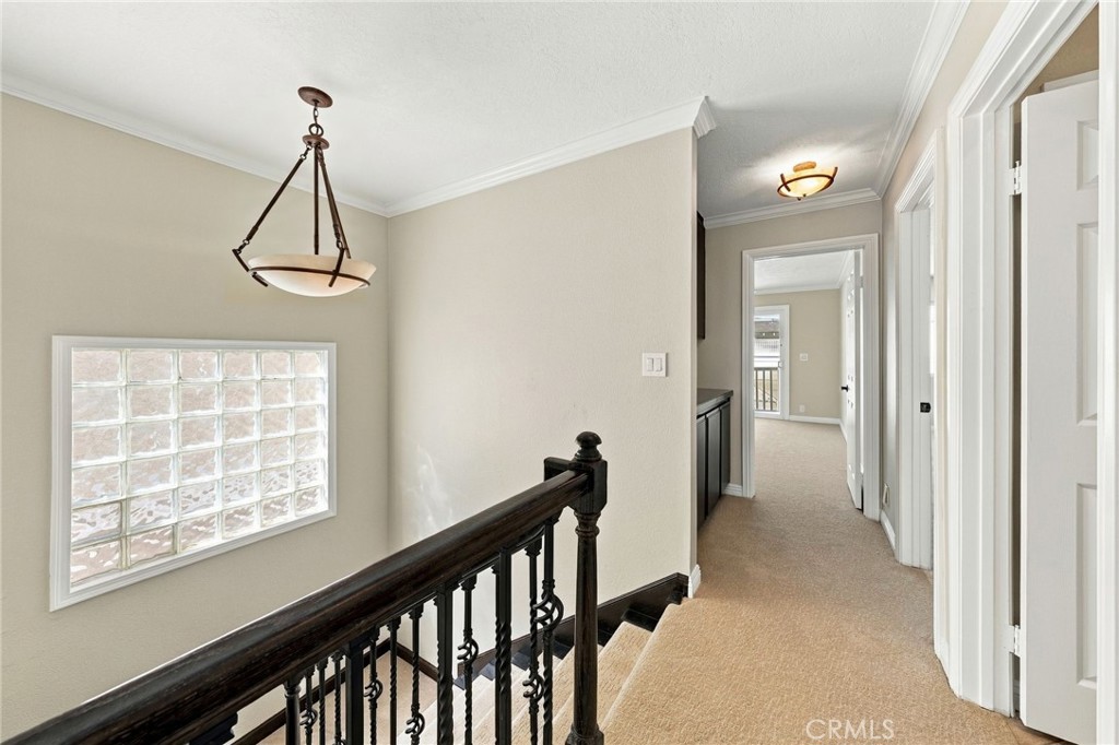 Upstairs hallway provides convenient access to the primary suite and secondary bedrooms. - 803 Frankfort Avenue, Huntington Beach CA 92648 - photo 41