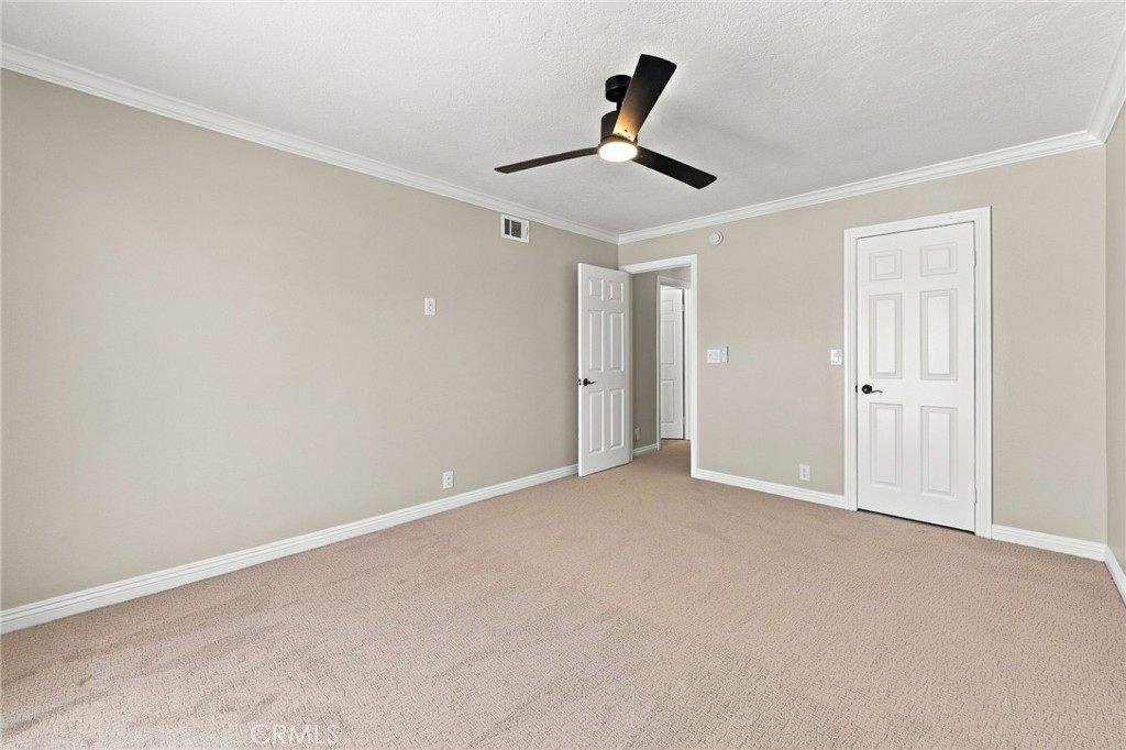 Another perspective showcases the generous size and fresh finishes of the secondary bedroom. - 803 Frankfort Avenue, Huntington Beach CA 92648 - photo 44