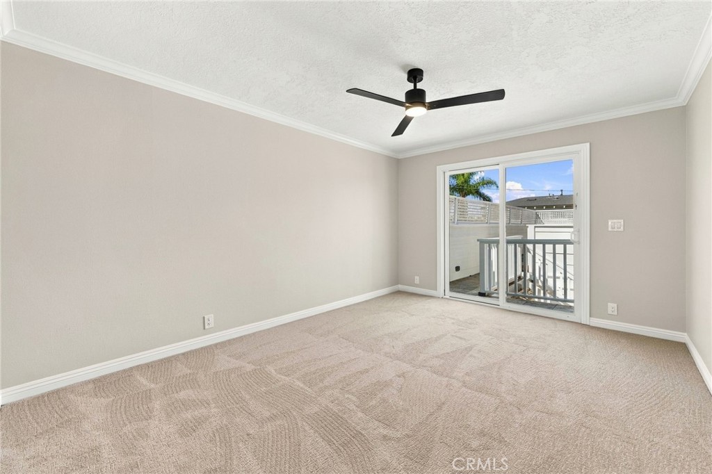 Third bedroom offers new carpet, ceiling fan, and a bright neutral interior. - 803 Frankfort Avenue, Huntington Beach CA 92648 - photo 47