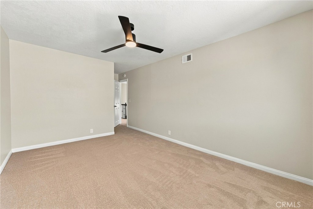 Spacious secondary bedroom provides flexibility for sleeping, office, or additional living space. - 803 Frankfort Avenue, Huntington Beach CA 92648 - photo 48