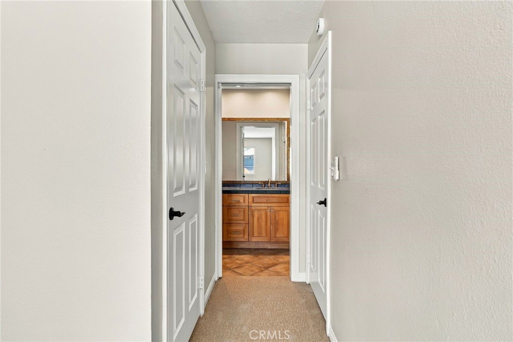 Upstairs hallway connects all three bedrooms and the shared hall bathroom. - 803 Frankfort Avenue, Huntington Beach CA 92648 - photo 50