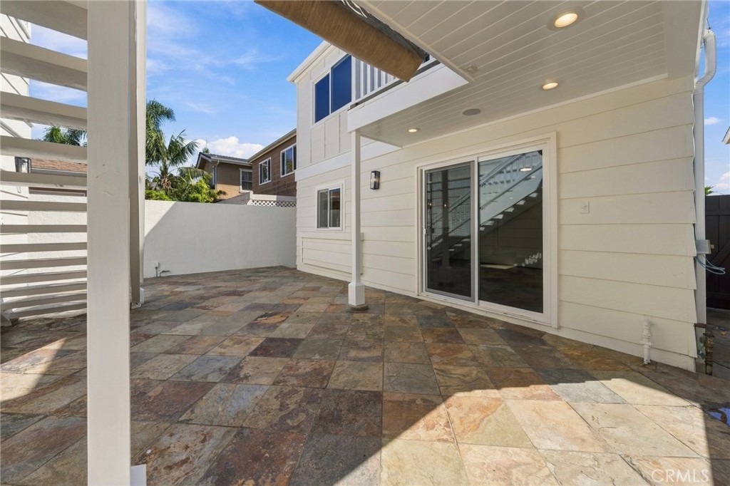Rear courtyard connects directly to the home and provides multiple areas to gather, dine, and relax. - 803 Frankfort Avenue, Huntington Beach CA 92648 - photo 54