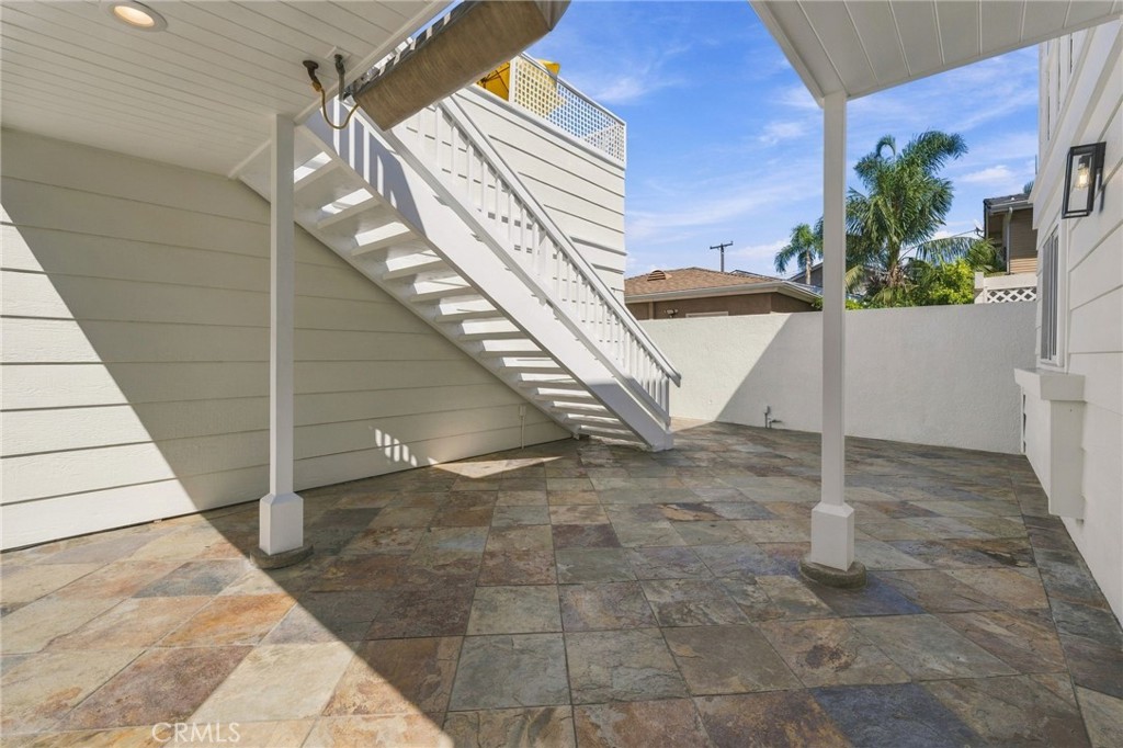 Covered portions of the courtyard offer additional shade and convenient access to the upper outdoor spaces. - 803 Frankfort Avenue, Huntington Beach CA 92648 - photo 55