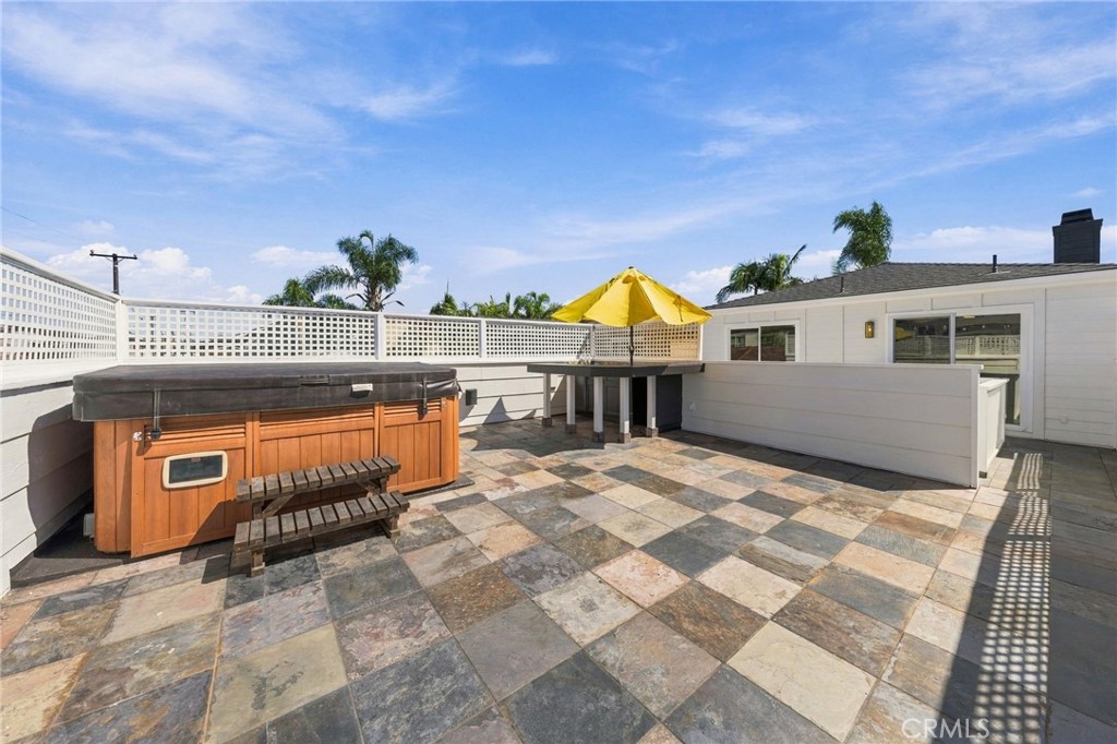 Spa deck provides a generous setting for lounging, dining, and enjoying the coastal climate. - 803 Frankfort Avenue, Huntington Beach CA 92648 - photo 58