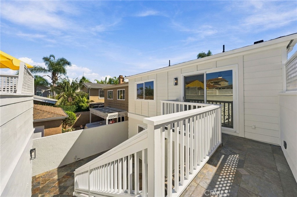 Elevated bridge connects the upper level of the home to the deck above the detached garage. - 803 Frankfort Avenue, Huntington Beach CA 92648 - photo 61