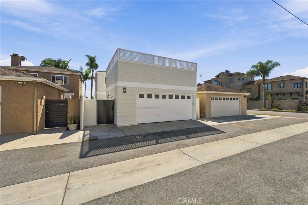 Rear alley access leads directly to the detached 2-car garage. - 803 Frankfort Avenue, Huntington Beach CA 92648 - photo 65