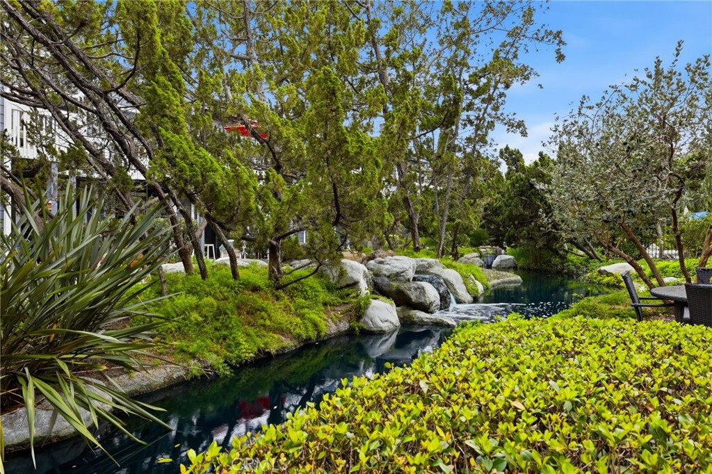 Lush landscape grounds with tranquil water features - 8132 Atwater Circle 202, Huntington Beach CA 92646 - photo 7