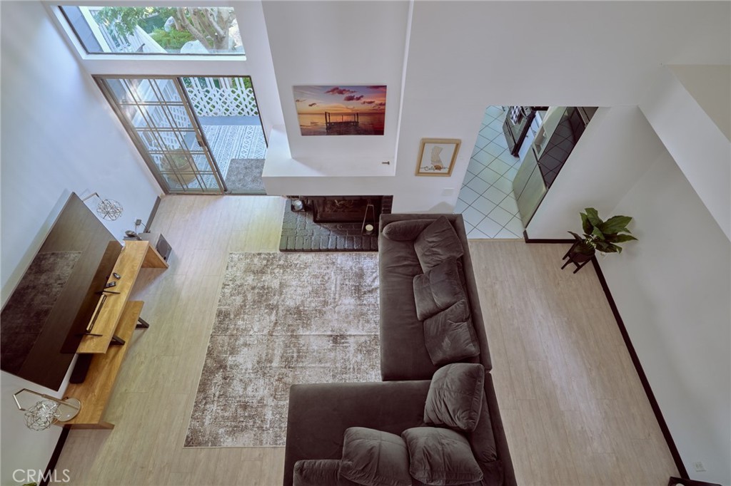 View down to living room from loft - 8132 Atwater Circle 202, Huntington Beach CA 92646 - photo 9