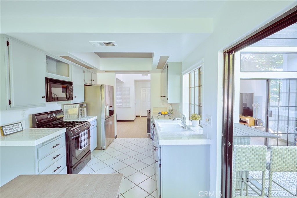 facing kitchen from the breakfast area - 8132 Atwater Circle 202, Huntington Beach CA 92646 - photo 25