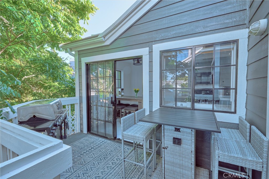 accessing balcony from family room - 8132 Atwater Circle 202, Huntington Beach CA 92646 - photo 26