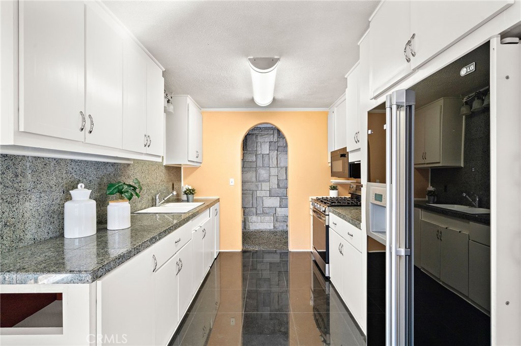 kitchen features granite countertops - 8142 Blaylock Drive, Huntington Beach CA 92647 - photo 13