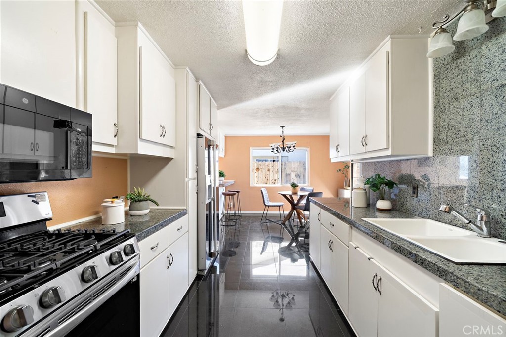 stainless steel oven, microwave - 8142 Blaylock Drive, Huntington Beach CA 92647 - photo 14