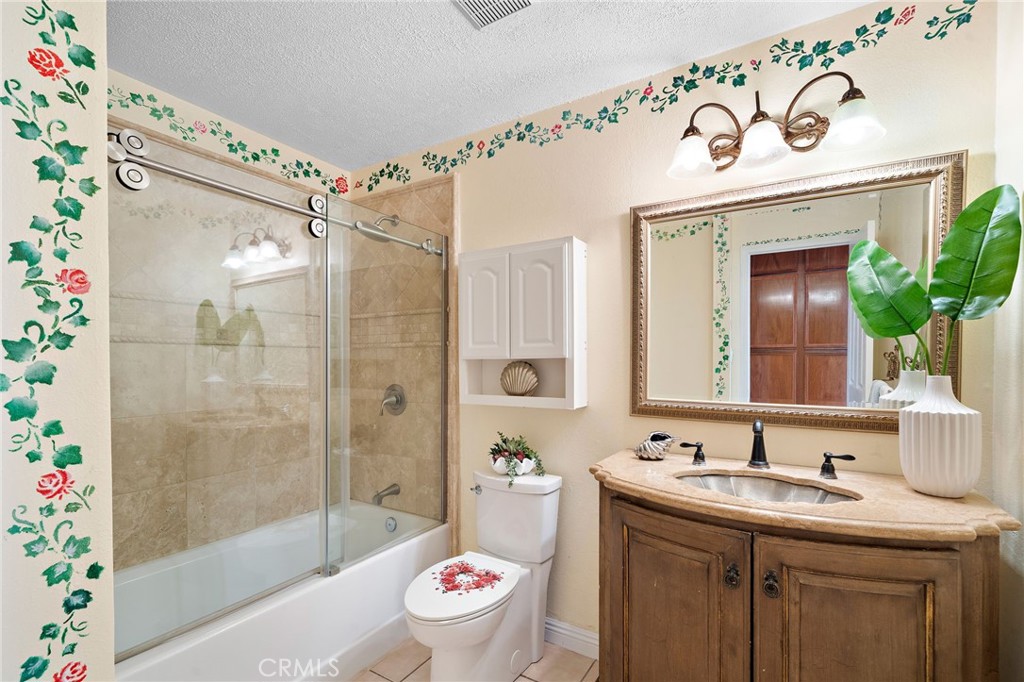 hall bath with shower tub combo - 8142 Blaylock Drive, Huntington Beach CA 92647 - photo 23
