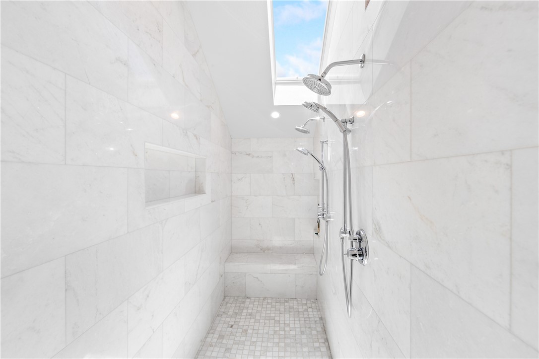 Primary bath walk in shower and skylight - 817 Main Street, Huntington Beach CA 92648 - photo 47