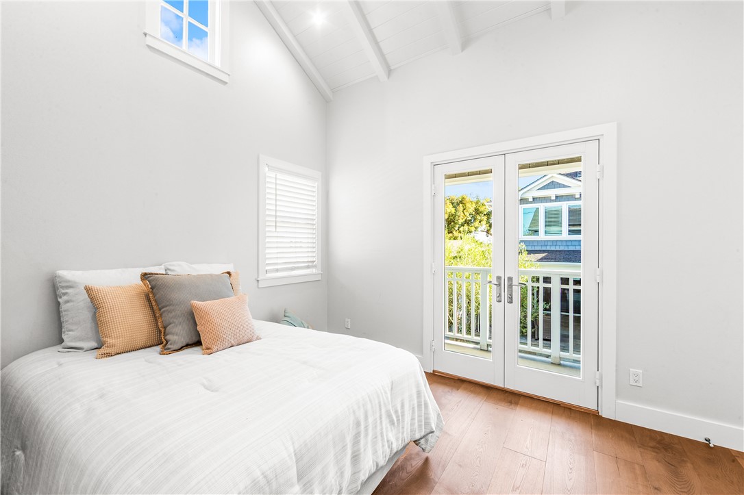 ADU bedroom with doors that open to the outside - 817 Main Street, Huntington Beach CA 92648 - photo 10
