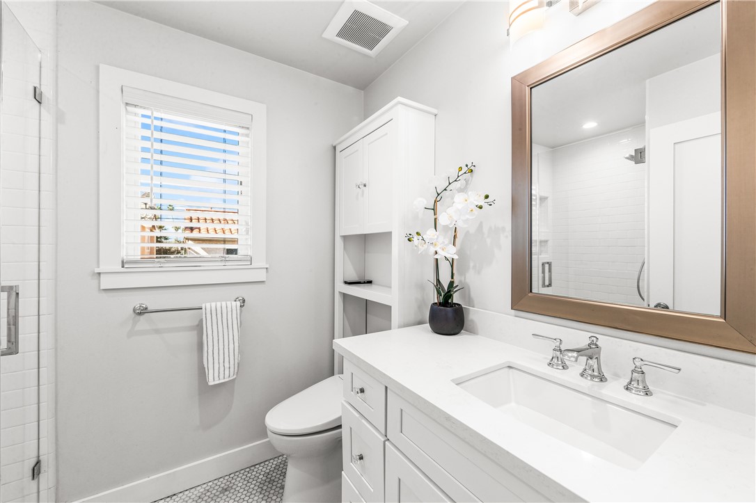 ADU bathroom with penny tiles - 817 Main Street, Huntington Beach CA 92648 - photo 11