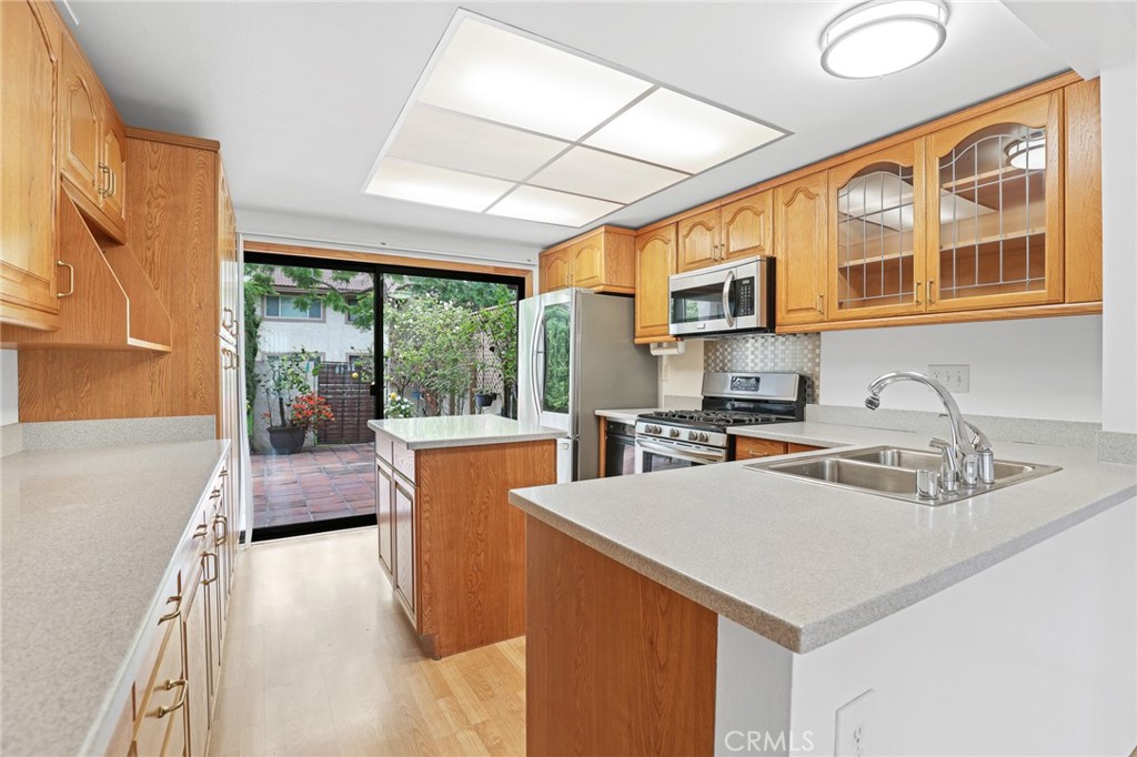 Kitchen island is easy to move or remove. - 8402 Sunbeam Cir, Huntington Beach CA 92646 - photo 6