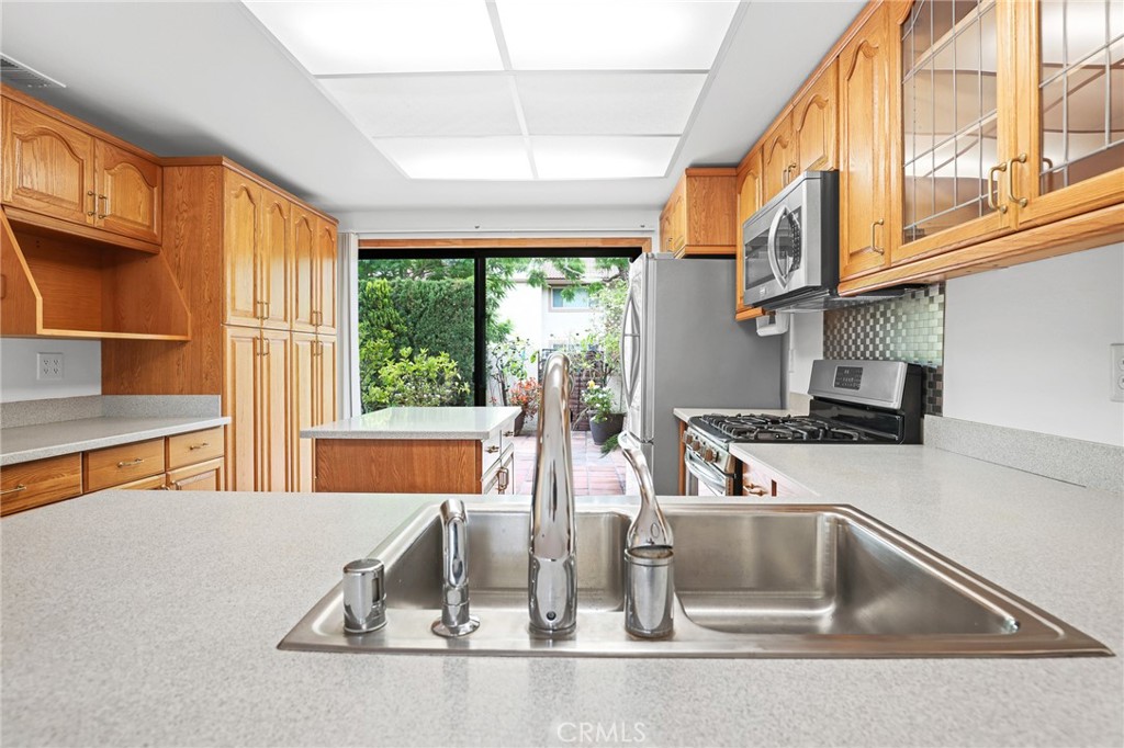 Kitchen island is easy to move or remove. - 8402 Sunbeam Cir, Huntington Beach CA 92646 - photo 8