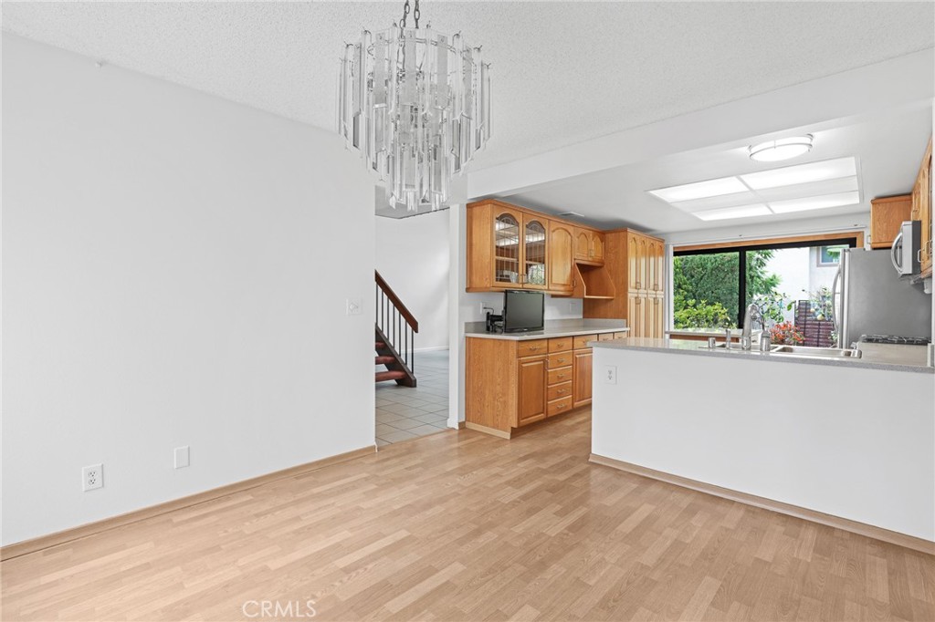 Kitchen island is easy to move or remove. - 8402 Sunbeam Cir, Huntington Beach CA 92646 - photo 9