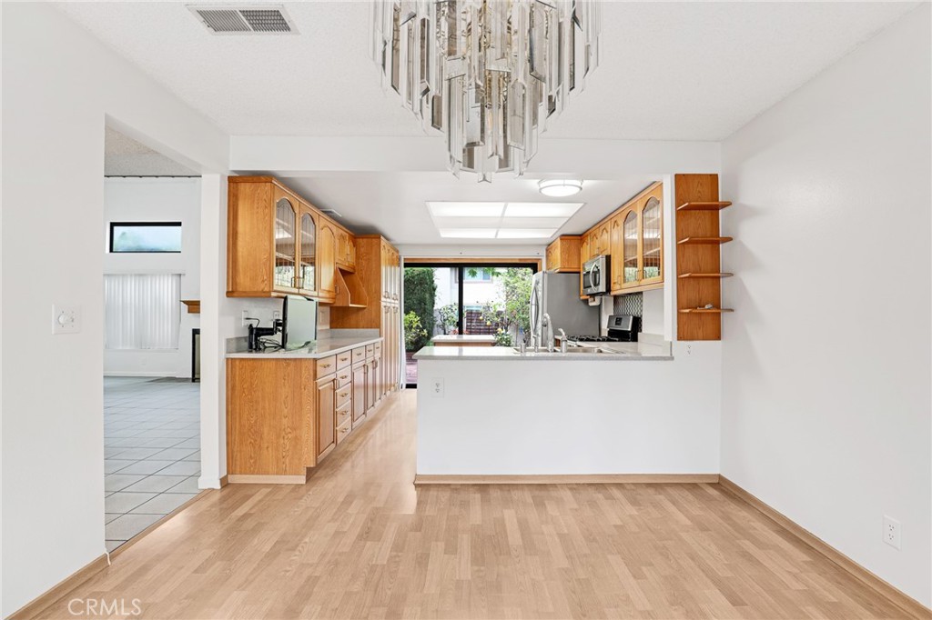 Kitchen island is easy to move or remove. - 8402 Sunbeam Cir, Huntington Beach CA 92646 - photo 10