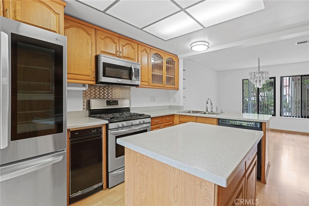 Kitchen island is easy to move or remove. - 8402 Sunbeam Cir, Huntington Beach CA 92646 - photo 12