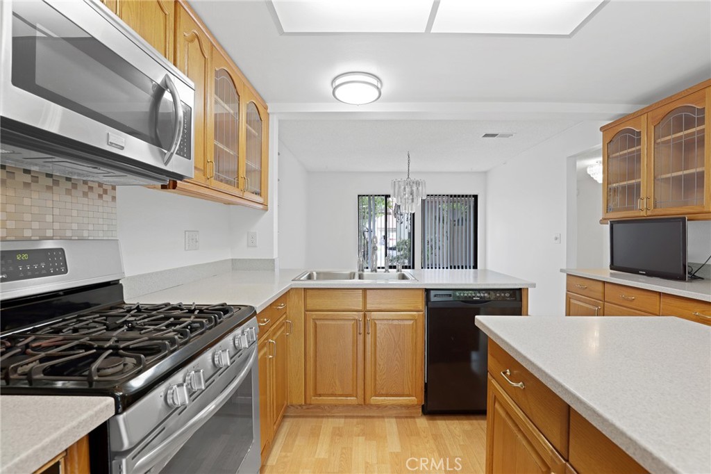 Kitchen island is easy to move or remove. - 8402 Sunbeam Cir, Huntington Beach CA 92646 - photo 13
