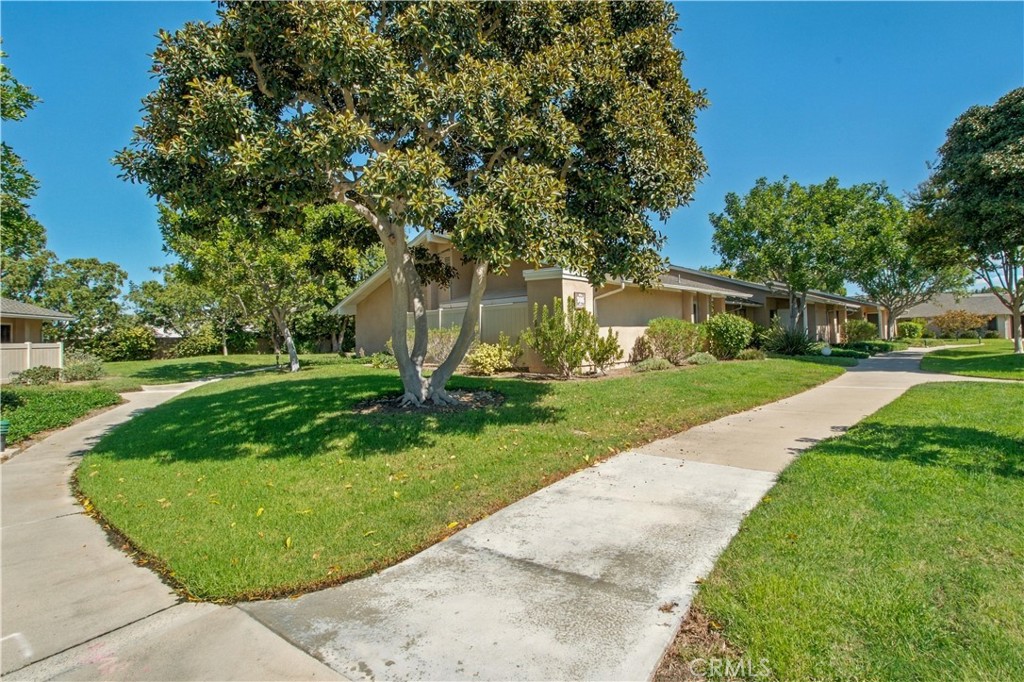 Mature trees and walking paths - 8565 Sierra Circle 916A, Huntington Beach CA 92646 - photo 2