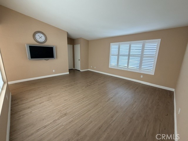 Main living area (tv/mount included) - 8566 Larkhall Circle 813B, Huntington Beach CA 92646 - photo 6