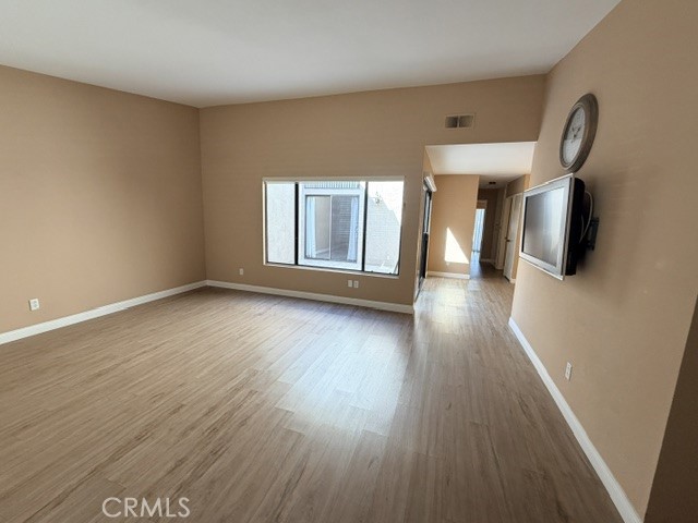 Main living area facing atrium - 8566 Larkhall Circle 813B, Huntington Beach CA 92646 - photo 7