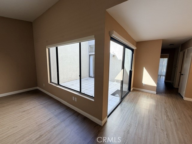 Main living, Central open atrium, dining area - 8566 Larkhall Circle 813B, Huntington Beach CA 92646 - photo 8