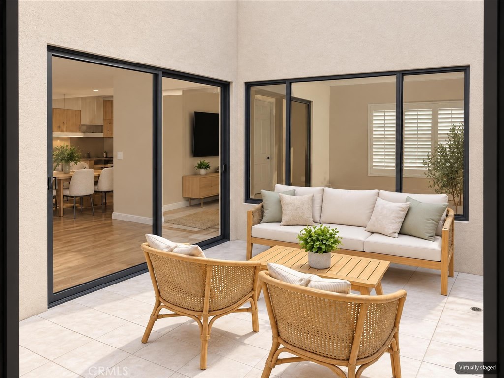 Central open atrium - "virtually staged" - 8566 Larkhall Circle 813B, Huntington Beach CA 92646 - photo 9