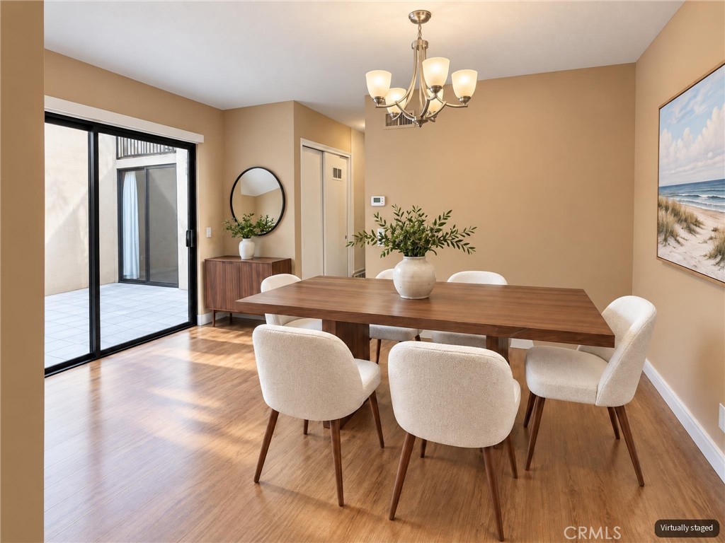 Dining area - "virtually staged" - 8566 Larkhall Circle 813B, Huntington Beach CA 92646 - photo 13