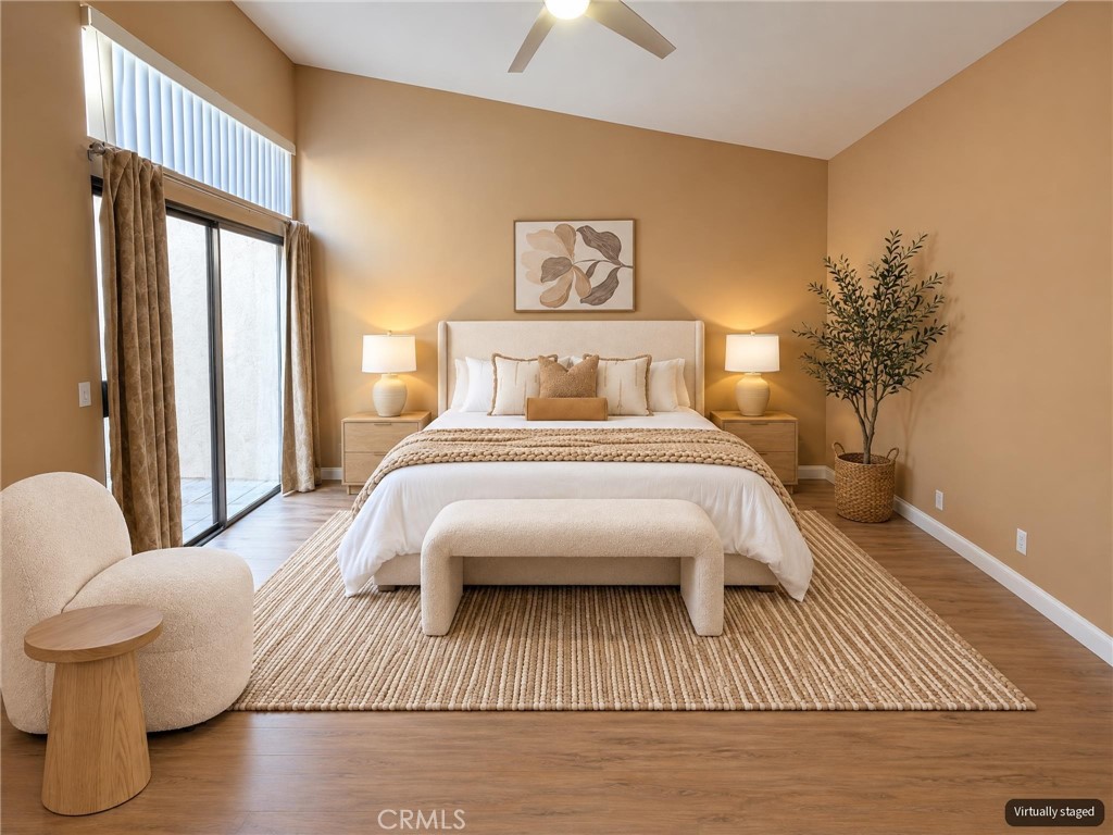 Primary bedroom - access to atrium - "virtually staged" - 8566 Larkhall Circle 813B, Huntington Beach CA 92646 - photo 23